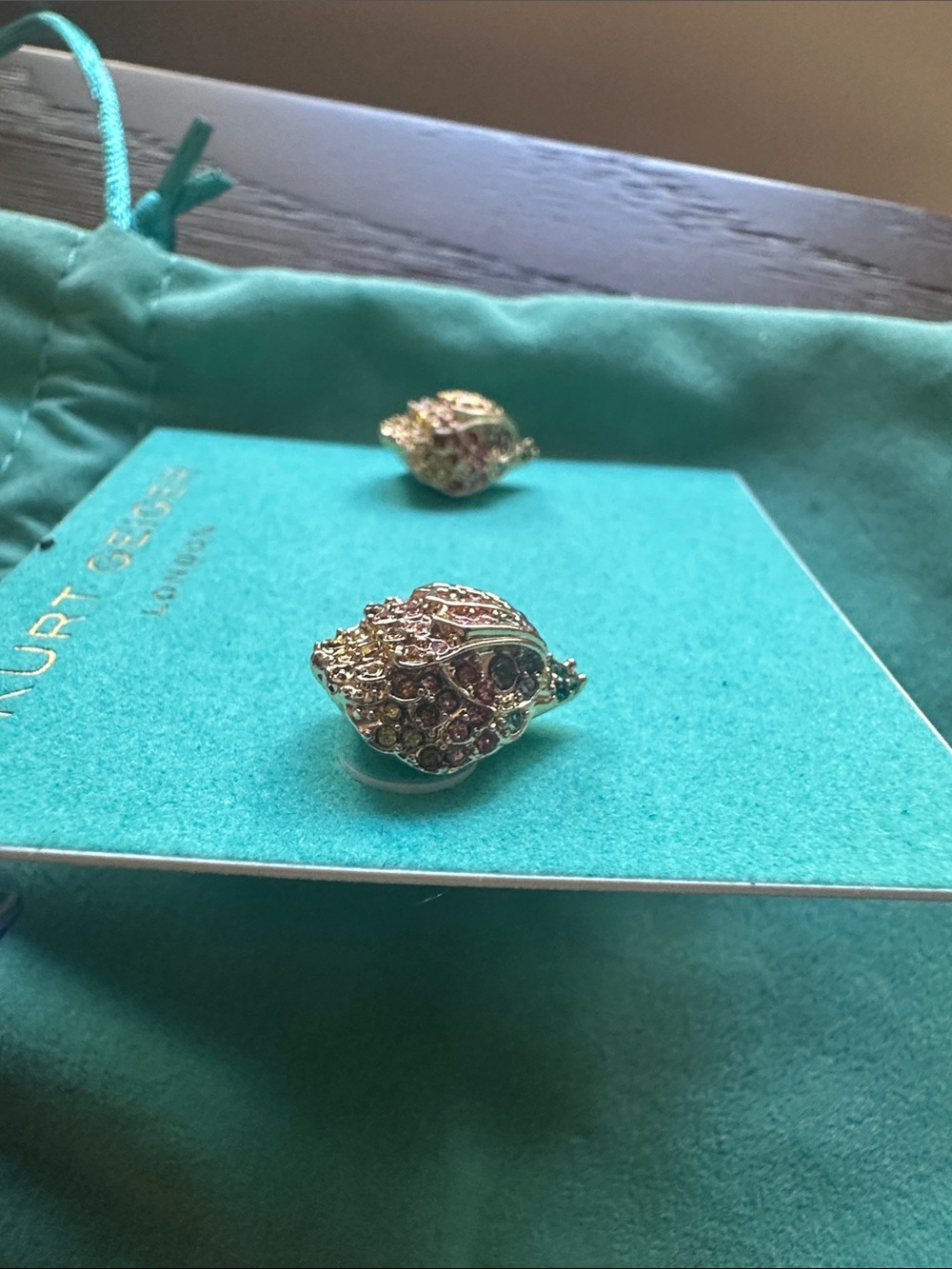 Kurt Geiger Gold Eagle Rainbow Crystal Stud Earrings with teal velvet pouch - Picture 3 of 4